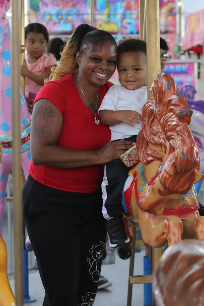 Family enjoying a carnival ride