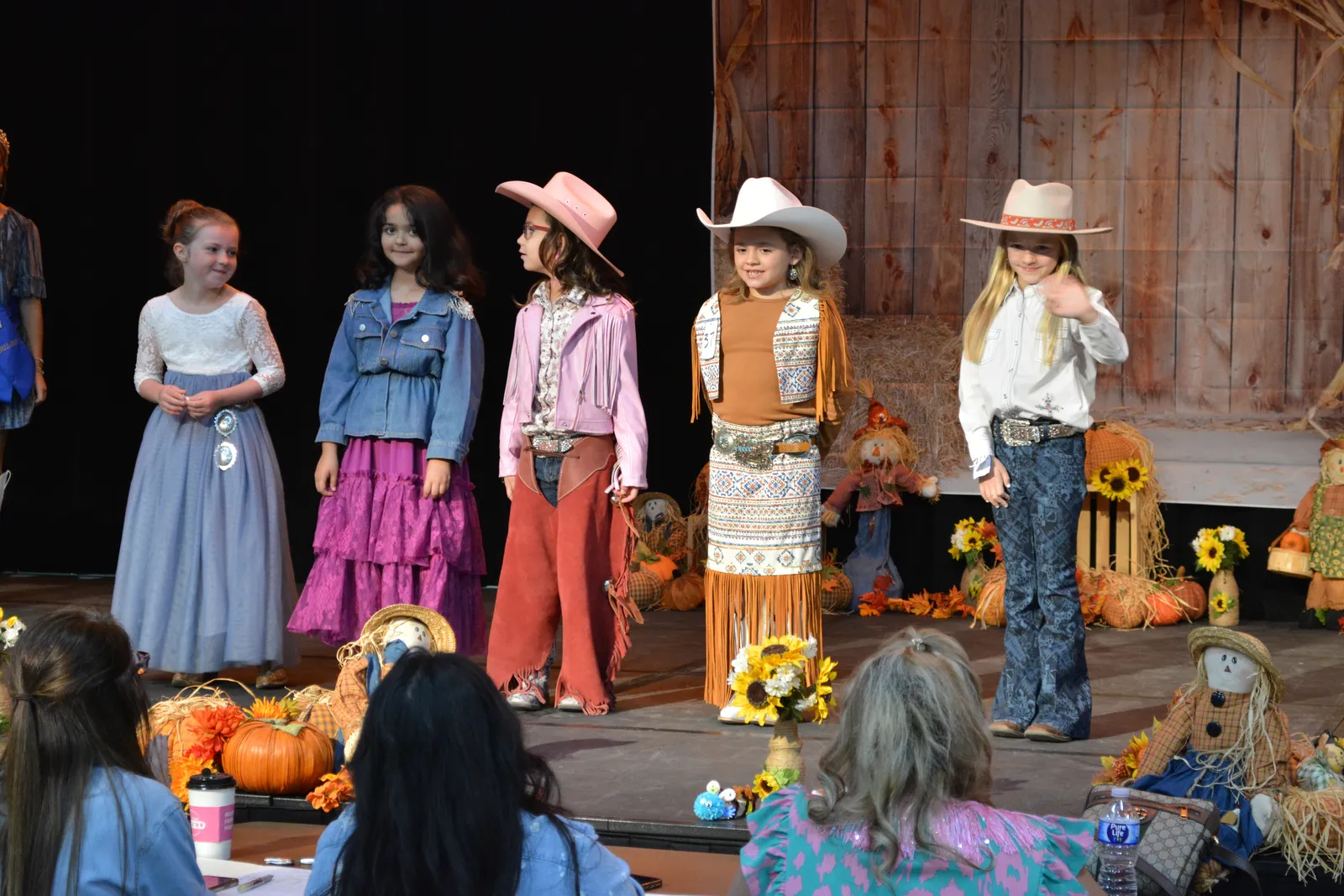 Children dressed in western wear at the fair