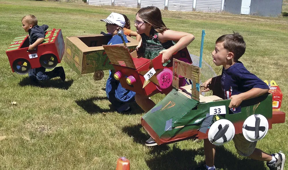Decorated box cars ready to race