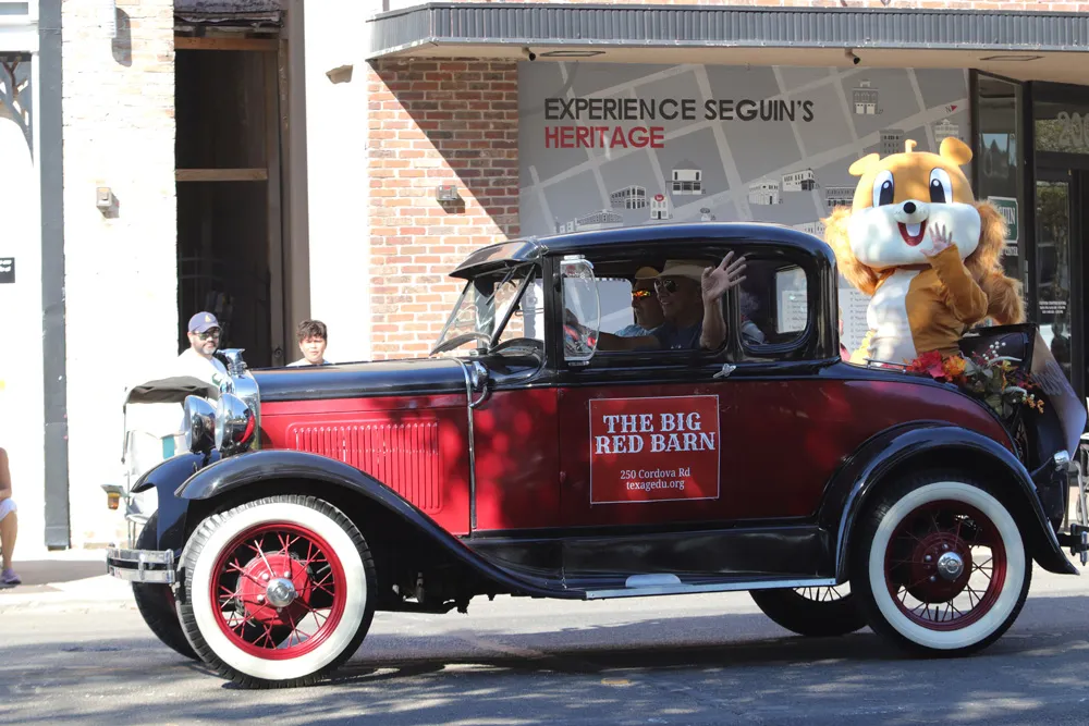 Parade entry moving through downtown Seguin
